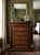 Bring timeless elegance and exceptional storage to any bedroom with this beautifully crafted traditional tall chest....