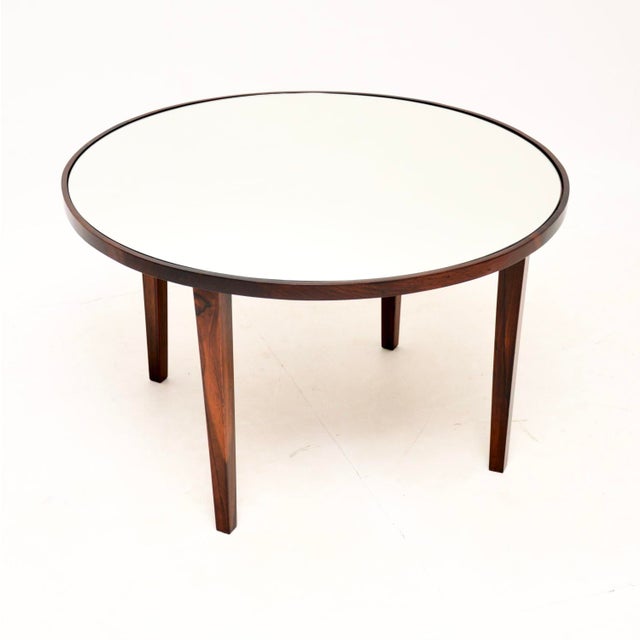 A very stylish and well made vintage mirrored coffee table, made in England and dating from the 1960’s. It is of superb...