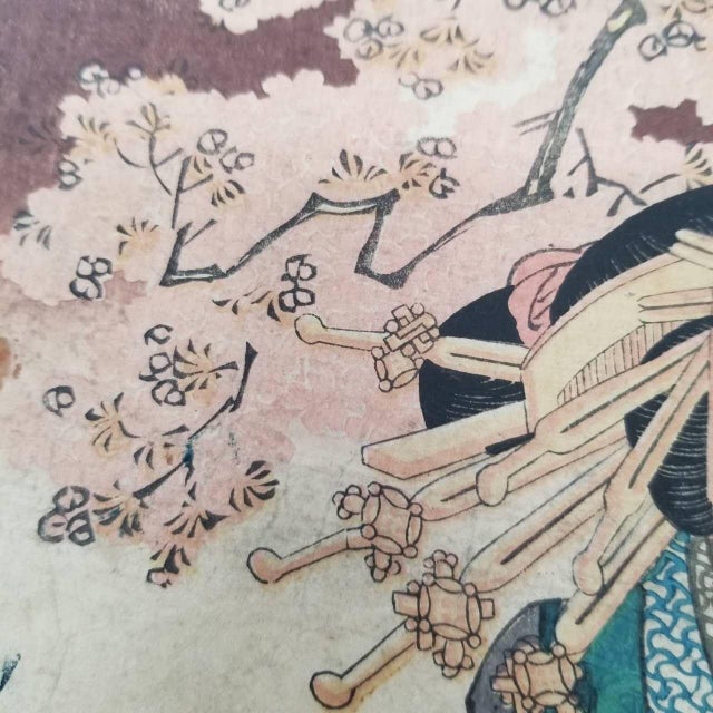 This is a Ukiyo-e style woodblock print reproduction, depicting a woman dressed in traditional Japanese attire. The...