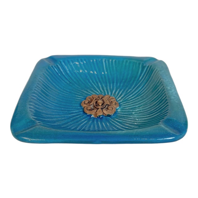 This is a vintage Italian ceramic ashtray produced by Ugo Zaccagnini, featuring a sculptural square form with softly...