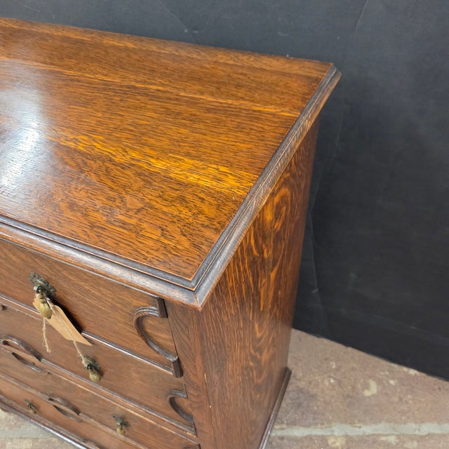 This Handsome Georgian Oak 4 Drawer Chest on Bun Feet With Decorative Molding Accents is perfect for a bedroom or as...