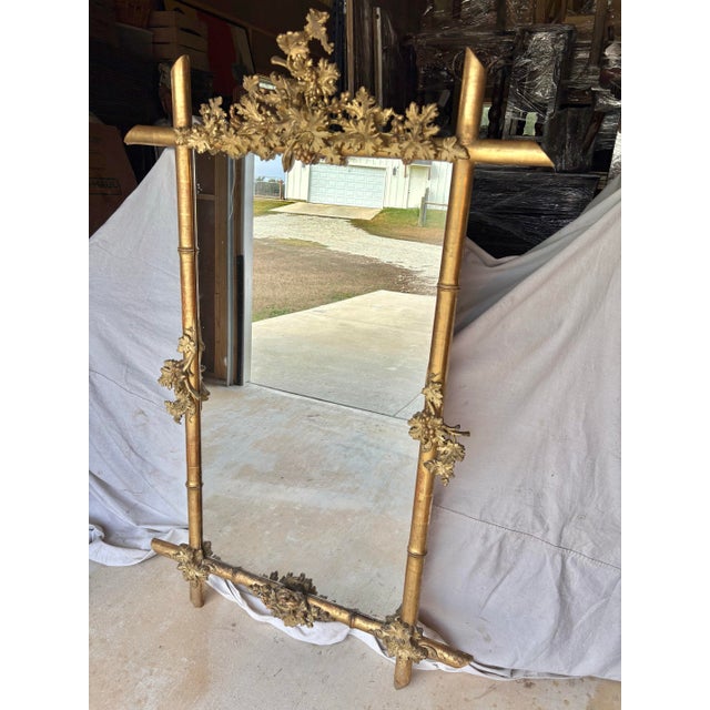Found in the South of France, this Mid 19th Century Faux Bamboo Giltwood Mirror was handcrafted by French artisans in the...