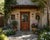 Puerta Carolina (Model 1013) – Handcrafted custom solid wood door featuring a rectangular top frame enclosing an elegant...