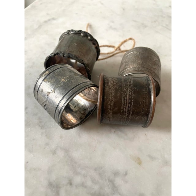 Wonder set of four mixed silver napkins rings. Beautiful carvings. A fantastic piece of history.