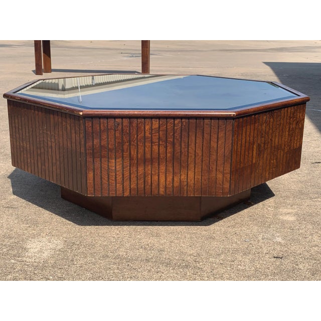 Gorgeous Mid Century style American of Martinsville coffee table with a smoked mirror top. Has superficial flaws in a...