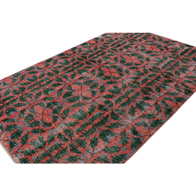Hand-knotted in wool, circa 1960 - 1970, this 6x9 vintage Müren rug is an exciting new addition to Rug & Kilim Mid-century...