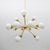 Extraordinary mid-century sputnik chandelier in brass and 16 opaline spheres in murano glass. also available in pairs. The...