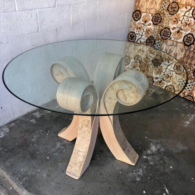 Vintage Coastal Twisted Pretzel Rattan Glass Top Dining Table in the Betty Cobonpue Style. Circa 1980s Features a beveled...