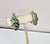 1960s goldtone green and blue enamel feather clip earrings. Marked "NAPIER" on the clips. Measure: 1 1/6 inches long by...