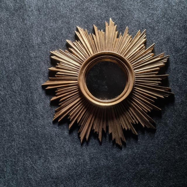 Sun mirror 1970s In golden resin Good condition Total diameter: approximately 40cm / mirror diameter: 14 cm / thickness 4cm