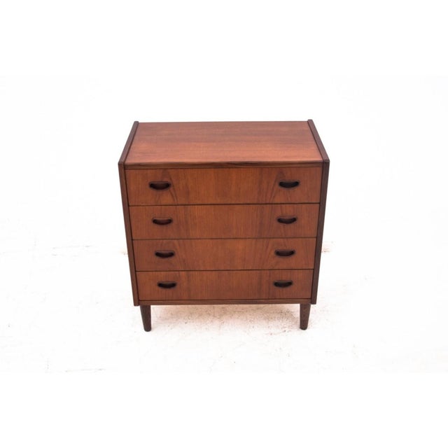 Teak chest of drawers, Denmark, 1960s The chest of drawers has four spacious drawers. The minimalist, timeless design will...