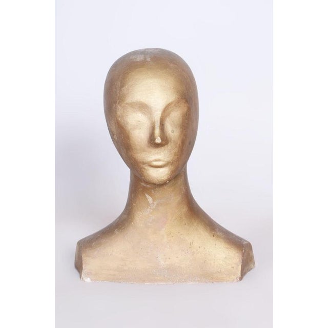 This impressive bust dates back to the 1960s and is made of patinated plaster, which gives it a specific historical...