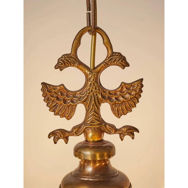 Beautiful flemish chandelier made of patinated brass. The arms are florally decorated. The top part with a flemish eagle....
