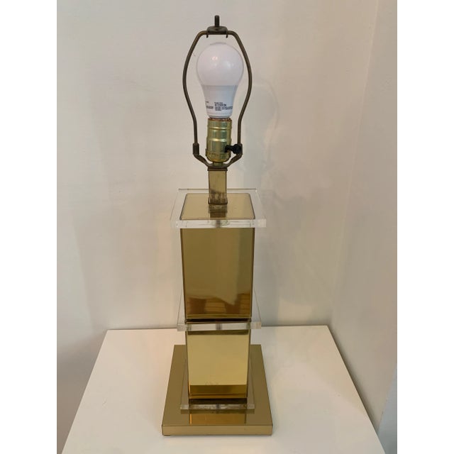 Square stacked brass and lucite table lamp. Perfect 70's style that transitions into all types of design settings.