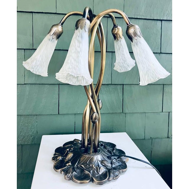 This delightful Meyda Tiffany rendition of Louis Comfort Tiffany's original 'Favrile' lily-pad lamp adds a fresh, delicate...