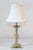This 20th-century gilded wood lamp exudes timeless elegance with its classic design and original gold leaf gilding, which...