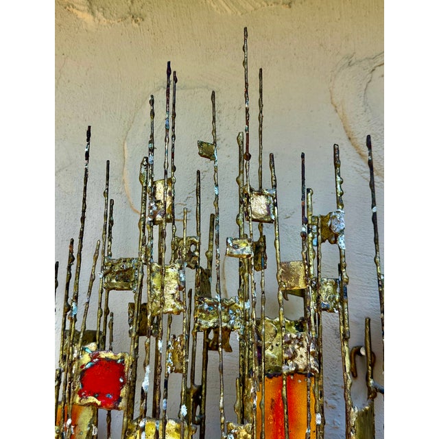 Multi colored enamel abstract wall sculpture in brass by California artist Donald Buby. Constructed of various sizes of...