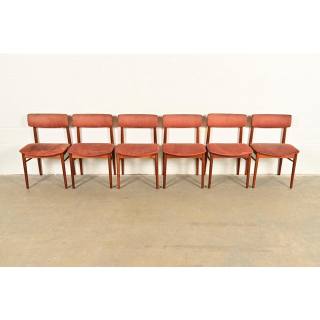 A sleek and stylish set of six mid-century Danish Modern dining chairs In the manner of Finn Juhl By Sven Chrobat for Sax...