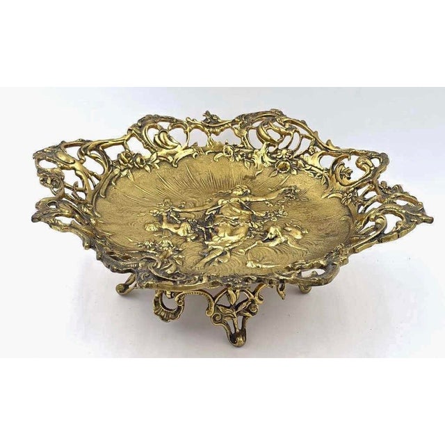 A distinguished three-piece Art Nouveau gilt bronze centerpiece set dating to circa 1895–1910, likely originating from...