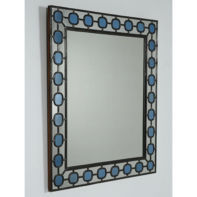 Mirror from the 1940s/1950s with a wooden frame covered in leaded glass, featuring baby blue oval inserts. Made by Älvsjö...