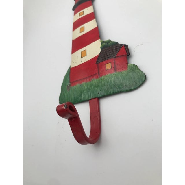 How charming would this hook be in a children’s room? We love the colors. Signed at the bottom by the artist but we can’t...
