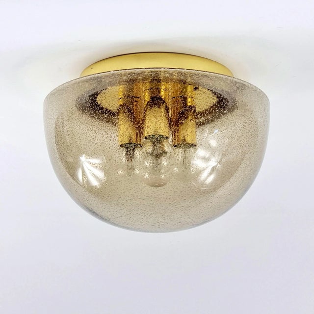 Stunning and large glass ceiling mount fixture from Limburg (Germany, 1970s). Mushroom shaped shade on brass base....