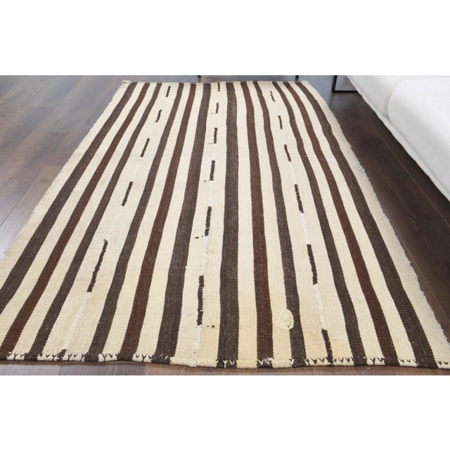 Vintage Turkish Hand-Knotted vintage rug is a semi-antique vintage kilim rug.'70s Eastern region of Turkey's unique rug is...