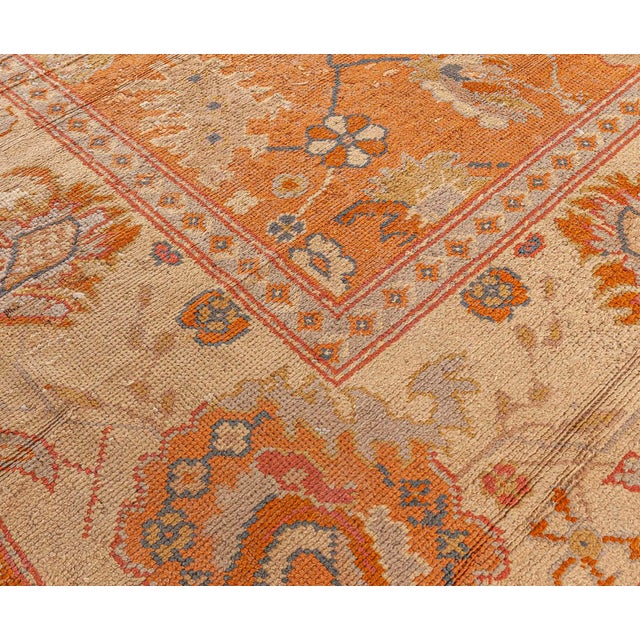 This exquisite antique Turkish Oushak rug, handwoven around 1900, beautifully exemplifies the hallmark features of...