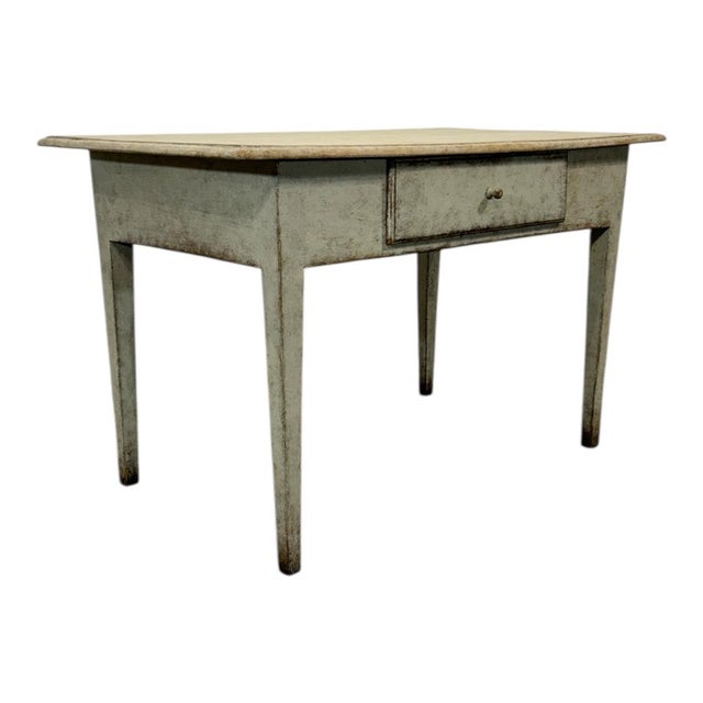 A mid 19th century Swedish farm table in white painted surface. A sturdy, useful size that can be used for dining, as a...