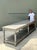 This monumental vintage rustic farm table is a remarkable example of traditional craftsmanship, distinguished by its...
