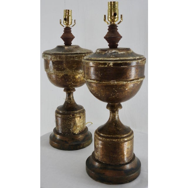 A pair of gilded pedestal electric lamps from the 19th century. The lamps have been restored with new brass push thru...