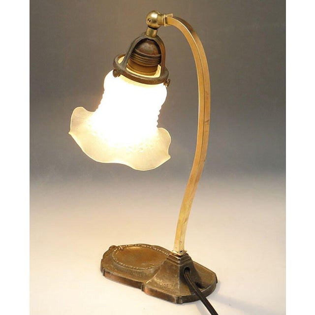 Table lamp produced in Austria-Hungary at the beginning of the twentieth century. The lampshade resembles a flower chalice...
