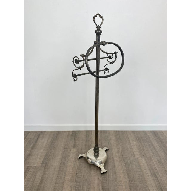 Mid-century floor towel holder in a silver brass structure made in Italy, circa 1950. The towel handles are embellished...