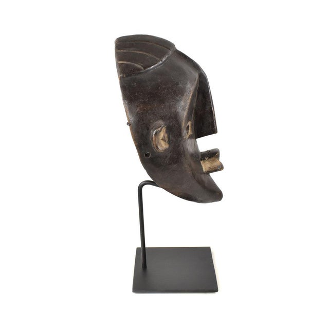 The Kwele Ekuk Mask, a profound cultural emblem hailing from Gabon's Kwele people, represents a key facet of their society...