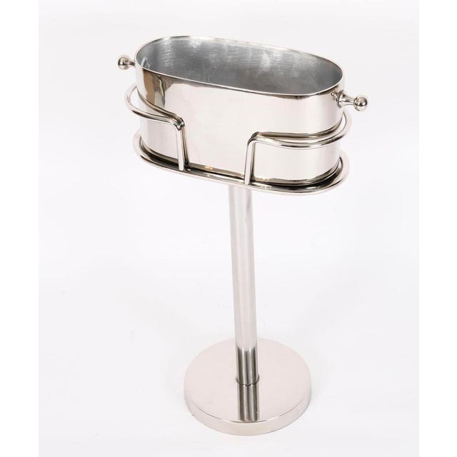 This is a fabulous vintage silver plated champagne / wine cooler on stand, late 20th Century in date. It features an oval...