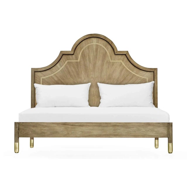 A Modern walnut and brass inlaid king size bed. The arched headboard with bleached figured walnut inlaid with brass trim...