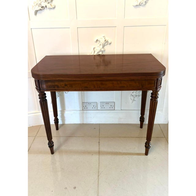 An antique George III Gillows stamped mahogany console hall card table of excellent quality featuring a fold over top and...