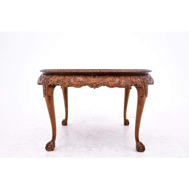 A carved table from the early 20th century. An elegant interior accent. It works perfectly as a coffee table in the living...