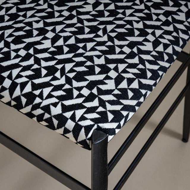 Set of seven side chairs, model Superleggera, designed by Giò Ponti in 1957. The chairs are made of dark stained wood with...