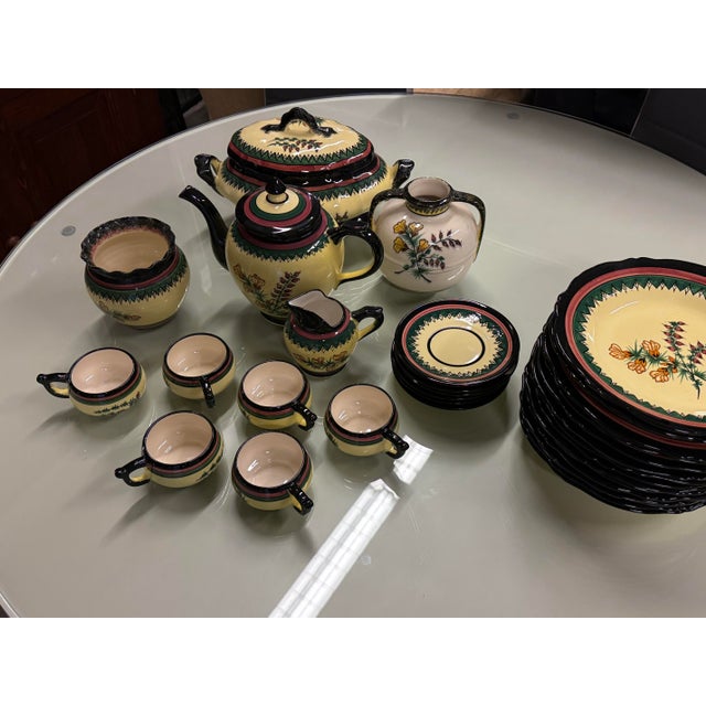 Design Plus Gallery presents Set of Thirty-One French Faience Serve-ware by Henriot Quimper. These are all handmade pieces...