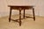 Circa 1900 oak table with two draw-leaves from France. The top and leaves are banded and follow down to a simple and...