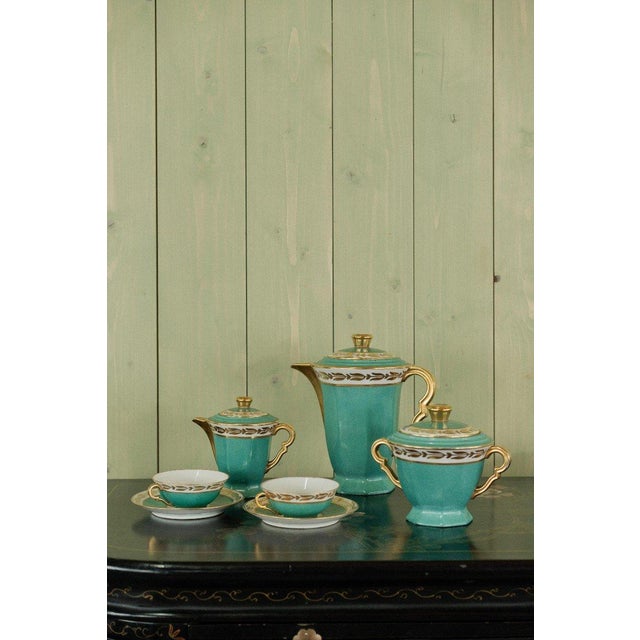 Turquoise and Gold Porcelain Tea Set by Yolande Manin: A Harmony of Color and Tradition We are delighted to offer this...