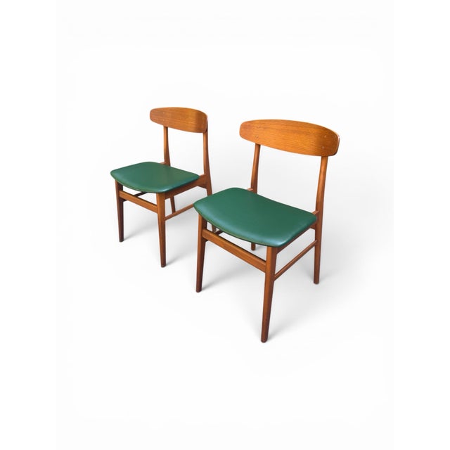 Bring authentic Scandinavian craftsmanship into your space with this striking pair of Mid-Century Modern chairs by SAX...