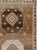 This Mid-20th century Turkish Anatolian room-size carpet presents a spacious geometric composition arranged across a warm...