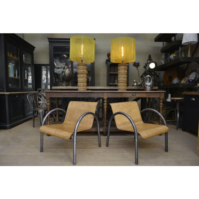 Pair of Old Design Armchairs 1950, tubular metal structure, seat in thermoformed beech veneered wood. Plastic protection...