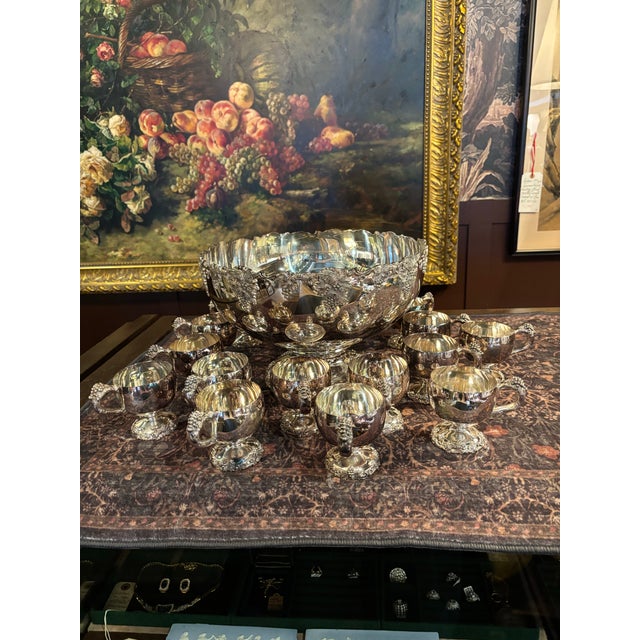 A striking vintage silver plate punch service by Webster Wilcox, beautifully executed in an ornate grapevine pattern that...