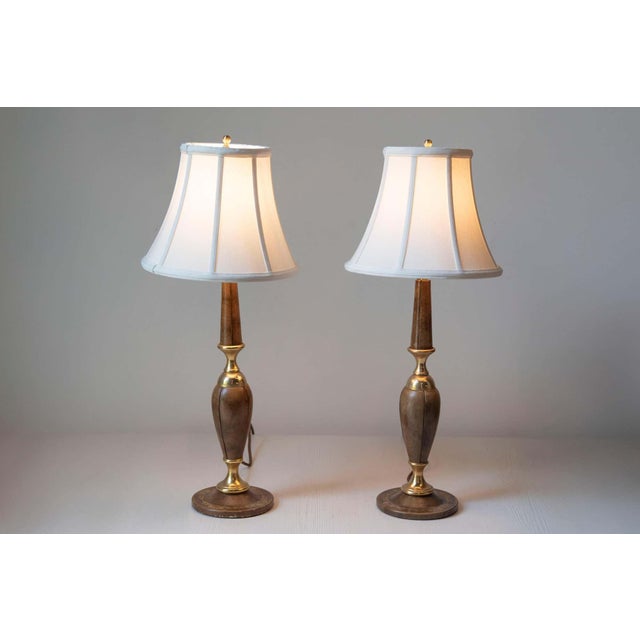 This elegant pair of 1970s lamps, inspired by designs from “Le Tanneur,” combines timeless craftsmanship with functional...