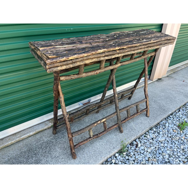 48 inches wide x 14 inches deep x 35 inches high Adirondack console table is two parts -Top and foldable base/ legs The...