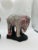 Chinese, 19th century or earlier. A PAIR OF CHINESE PORCELAIN FLAMBE-GLAZED ELEPHANTS. Each elephant is a modeled mirror...