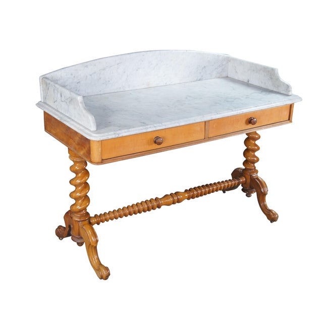 Antique Victorian walnut washstand / dry sink / desk featuring a white marble top with arched backsplash, two drawers, and...